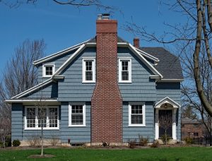 Large home with blue siding